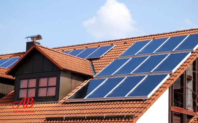 AB Electrical Services A house with solar panels installed on its red-tiled roof under a blue sky. Orange County CA