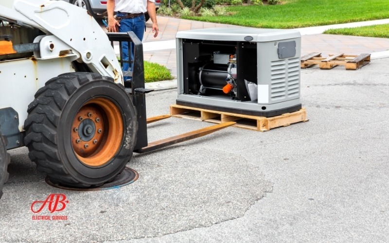 AB Electrical Services A forklift is moving a standby generator on a pallet along a residential street, with a worker standing nearby—showcasing professional home generator installation. The AB Electrical Services logo appears in the lower left corner. Orange County CA